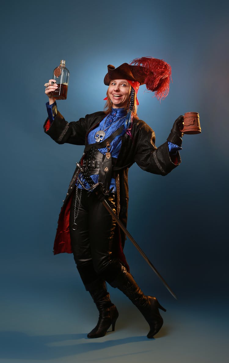 Drunk Woman In Pirate Costume With Rum And Vintage Mug