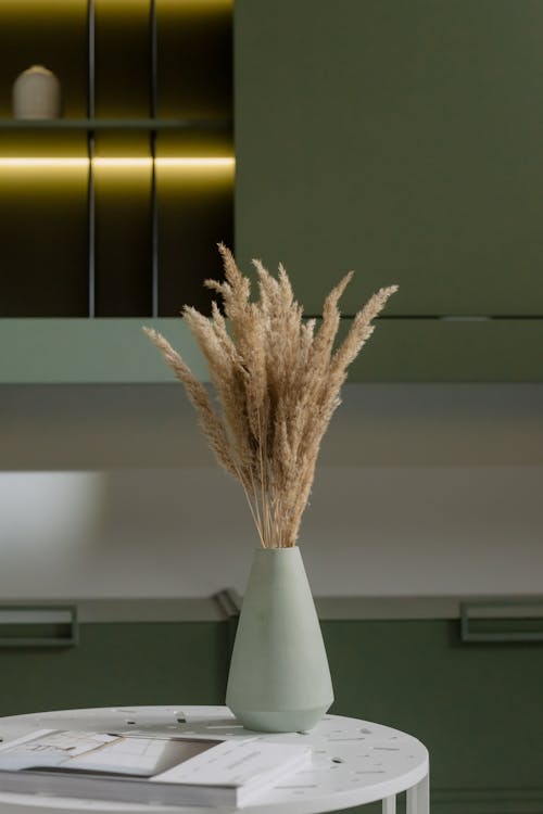 Brown Dried Flowers in Ceramic Vase