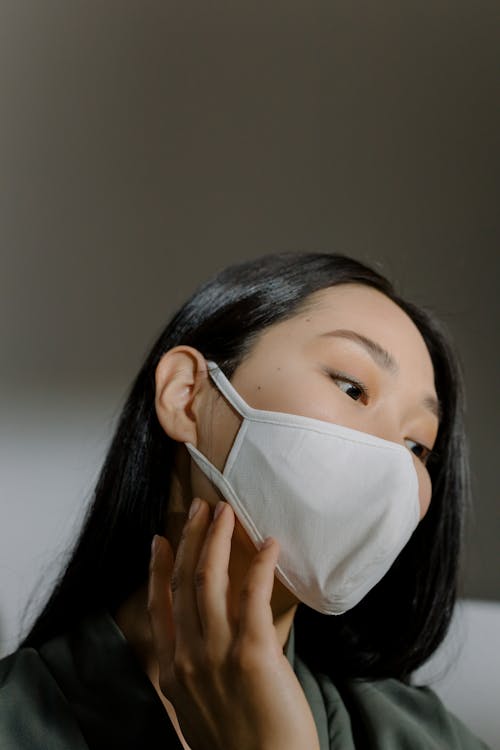 Free 
A Woman Wearing a Face Mask  Stock Photo