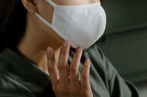 Free Person Wearing White Face Mask Stock Photo