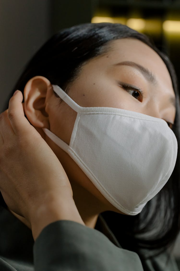 Woman With White Face Mask