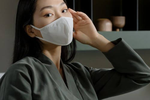 Free 
A Woman Wearing a Face Mask and a Robe Stock Photo