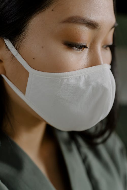 Crop woman in medical mask