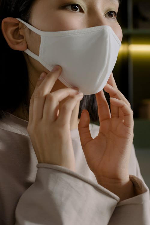 Free A Close-Up Shot of a Woman Wearing a Face Mask Stock Photo