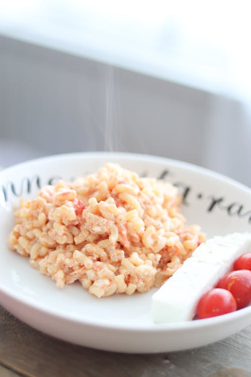 Risotto, White Cheese and Tomatoes on Plate