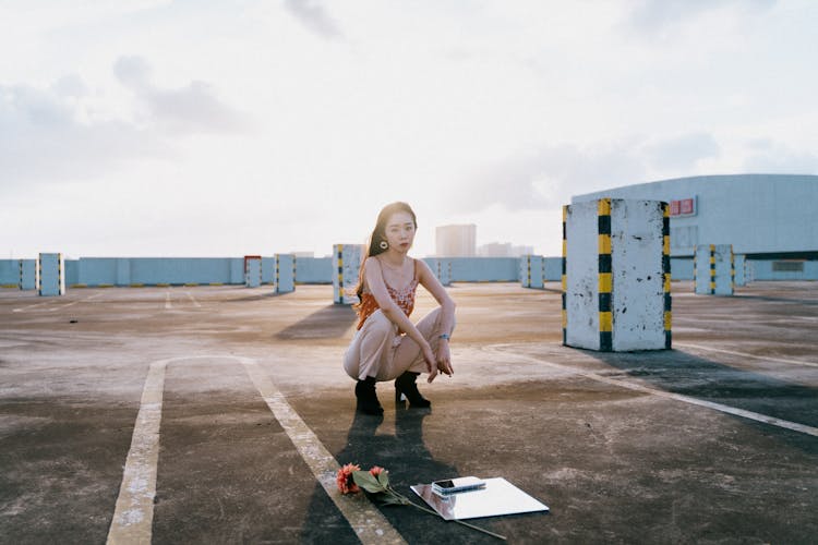 Woman Posing On Car Park On Roof