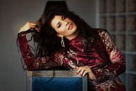 Alluring model in earring and elegant wear at home