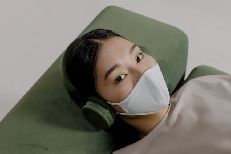 Woman Wearing Face Mask And Headset 