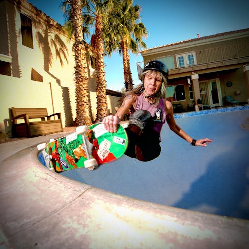 Free Woman Riding a Skateboard Stock Photo
