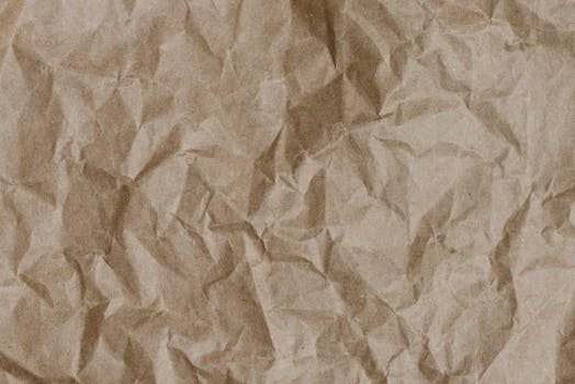 Abstract texture of crumpled craft paper, ideal for design and background use.