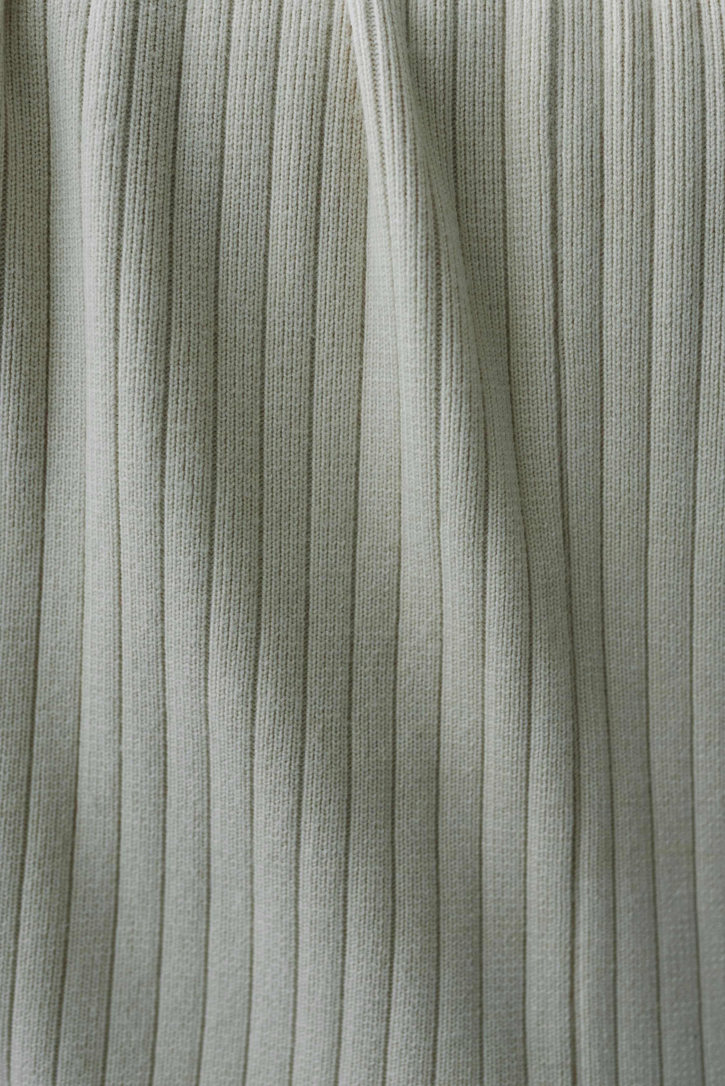 gray striped fabric placed on table