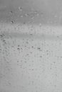 Wet window during rain on gloomy day
