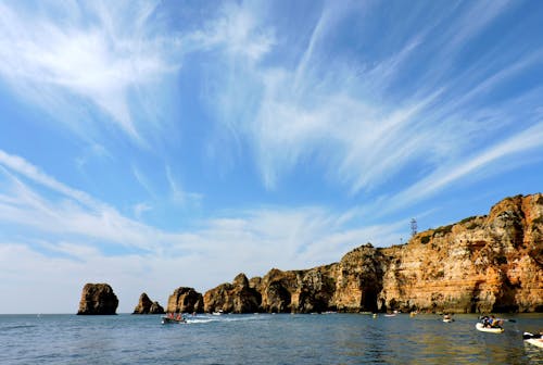 People Paddle Boating in the Sea