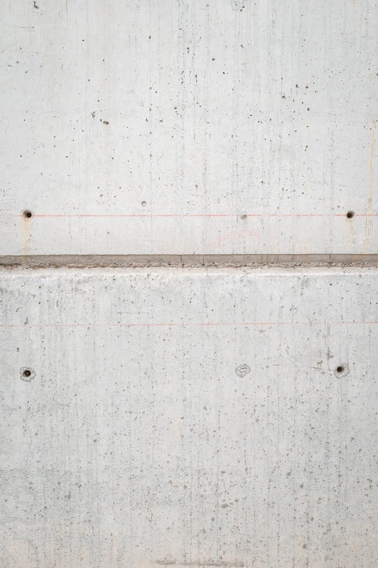 A Concrete Wall With Holes