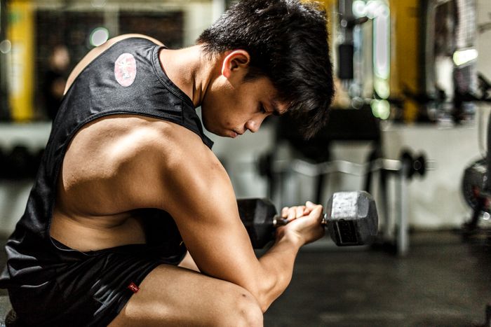 Man working out with dumbbells in the gym