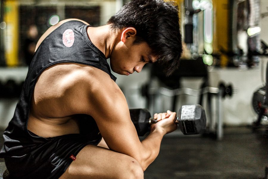 Athlete wearing a black training tank top