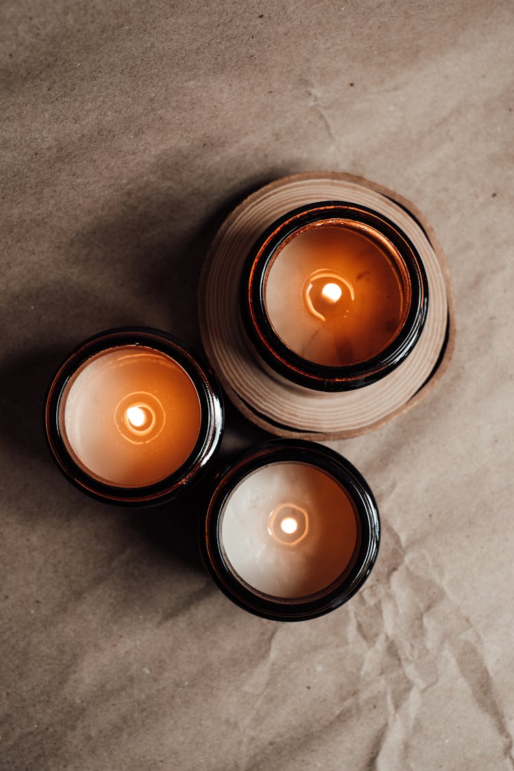 Candle In Brown Glass Containers