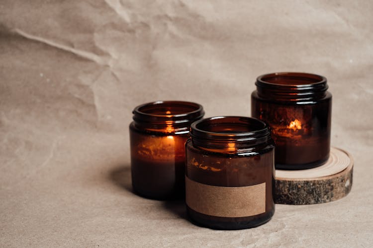 

Lighted Candles In Glass Containers