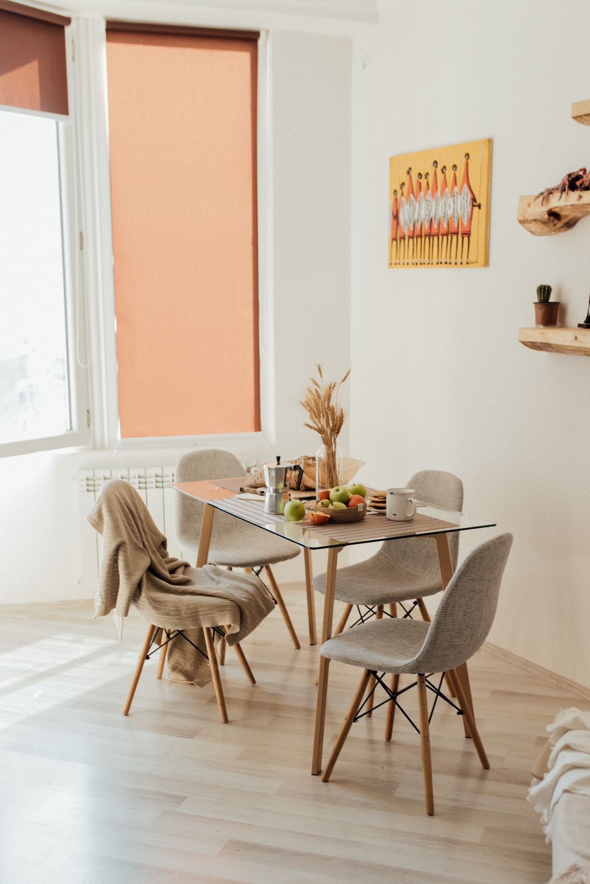 Cozy dining area with modern furniture and natural lighting in a minimalist home setting