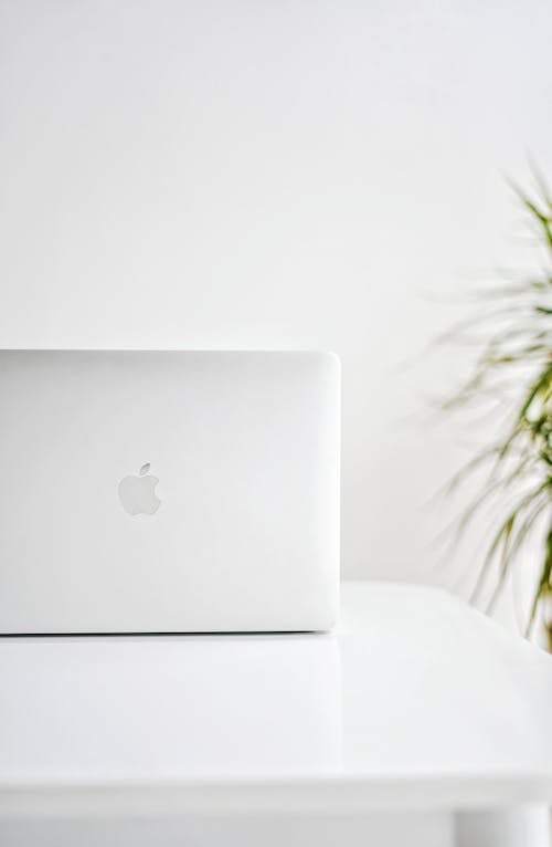 An Apple Laptop on White Table
