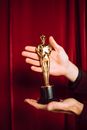 Gold Trophy on Persons Hand