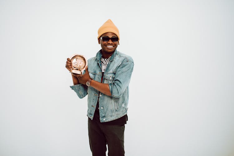 Man Holding A Music Award