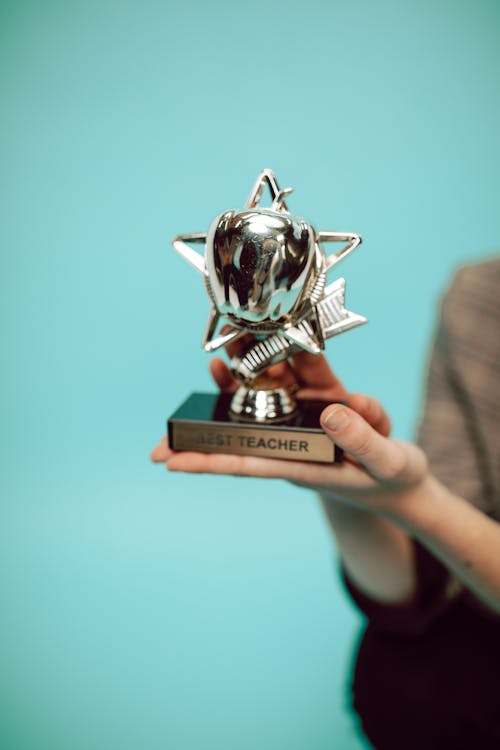 Free Person Holding Silver Trophy Stock Photo