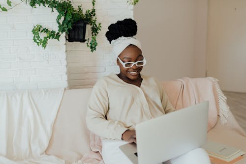 Woman Wearing Eyeglasses Using a Computer Laptop