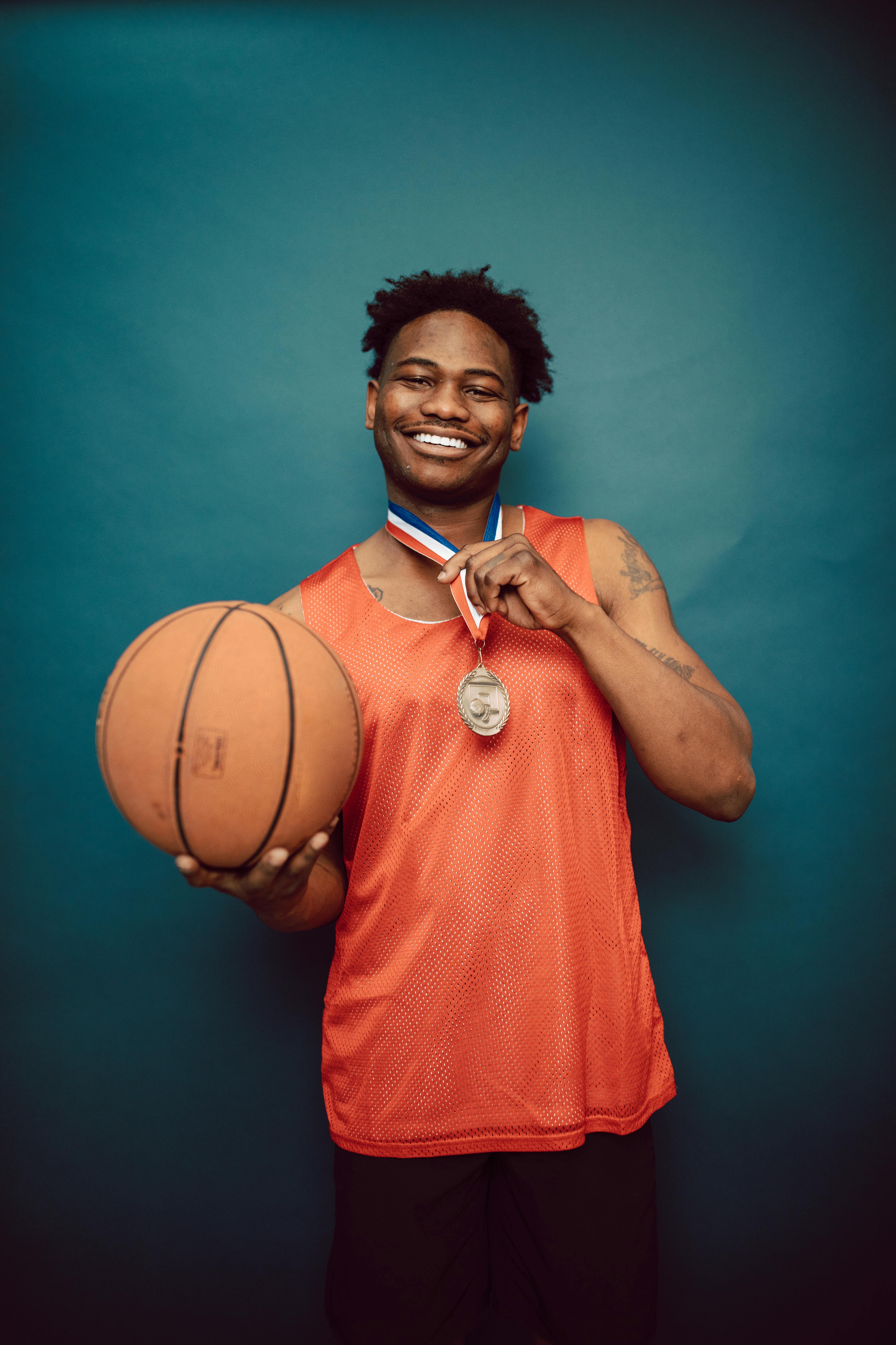 a basketball player with a medal