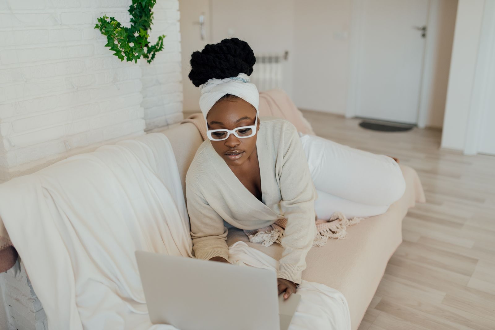 Woman wearing glasses while shopping online on a laptop