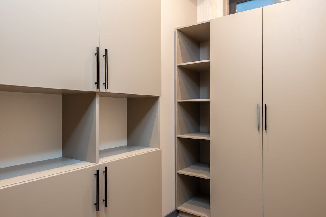 Free Minimalist styled wardrobe with empty shelves in room Stock Photo