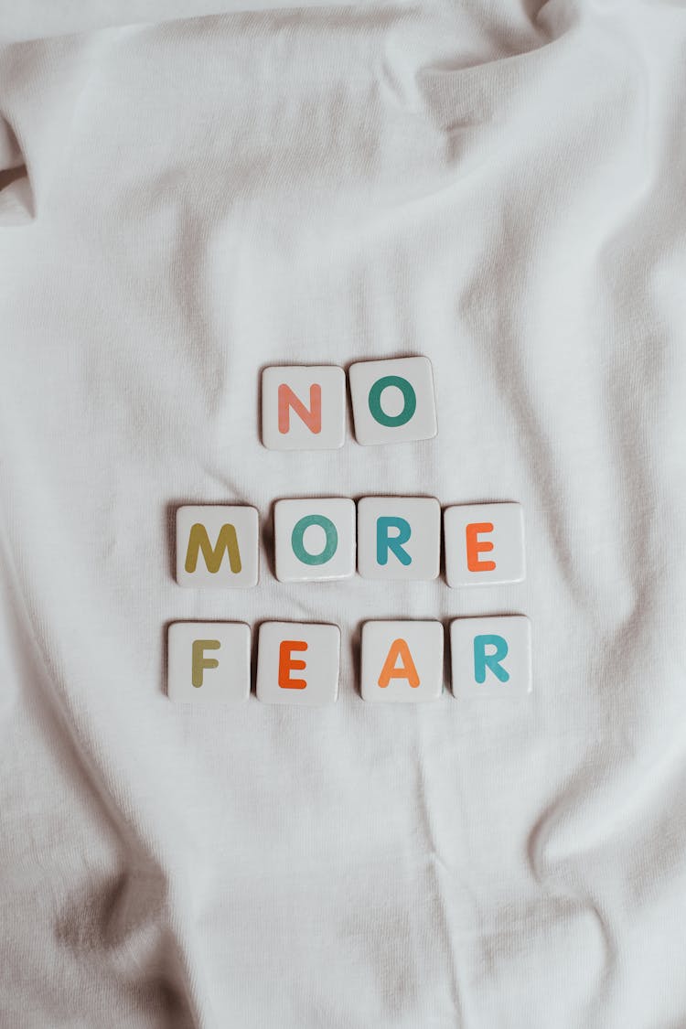 The Phrase No More Fear On A Sheet Of Fabric