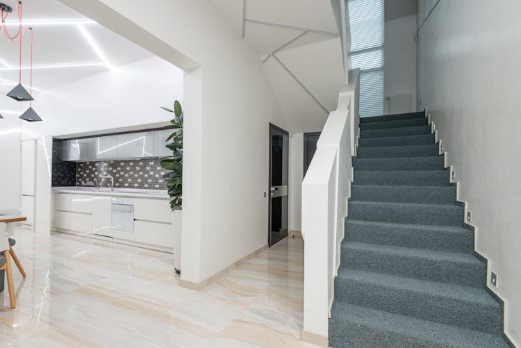 Hallway With Stairs In Modern Villa With Spacious Kitchen