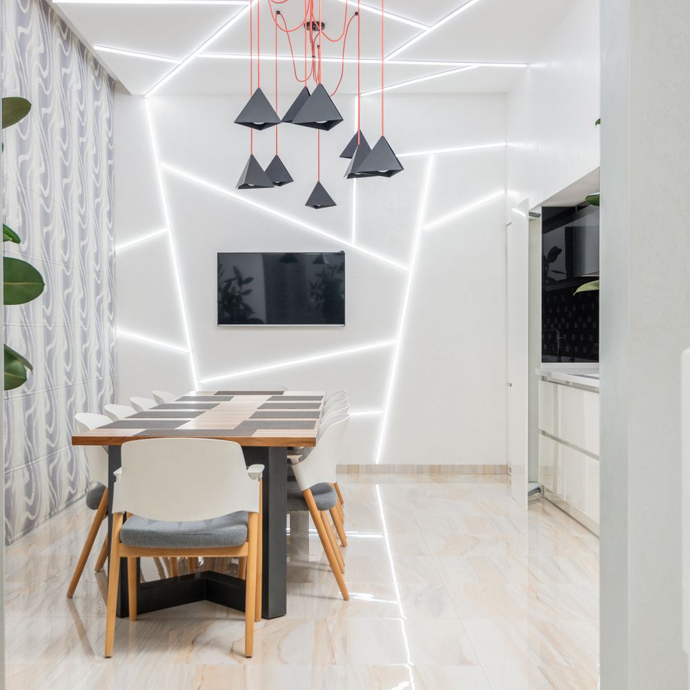 Wallpapering in Bow — careful masking before painting begins