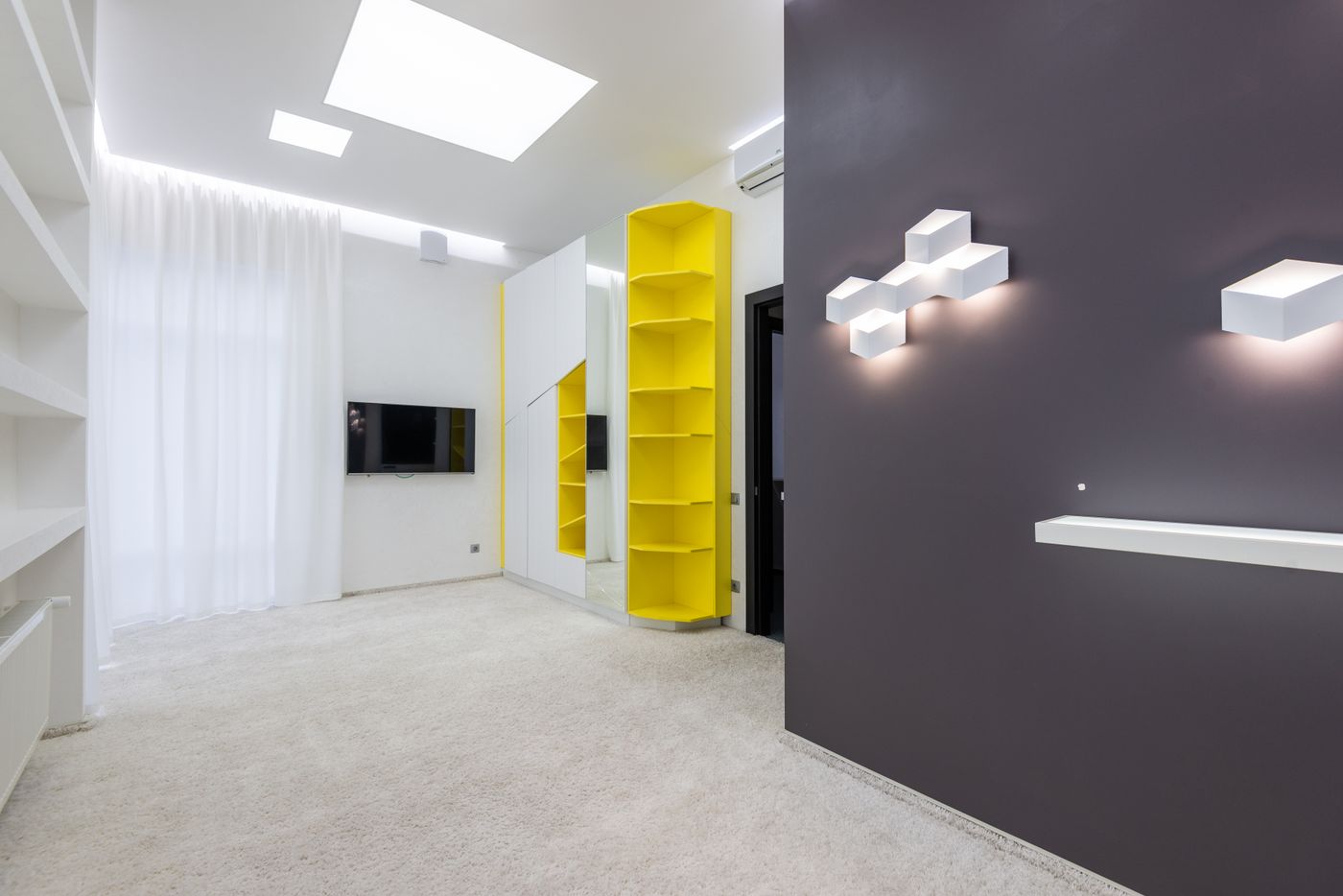 Modern living room with recessed ceiling lighting