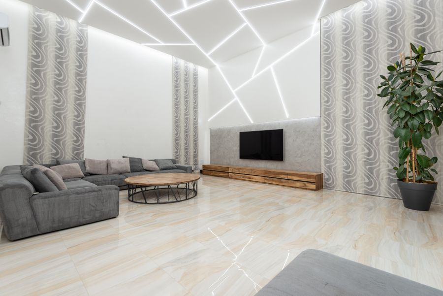 Bright living room with wall-mounted TV and accent lighting