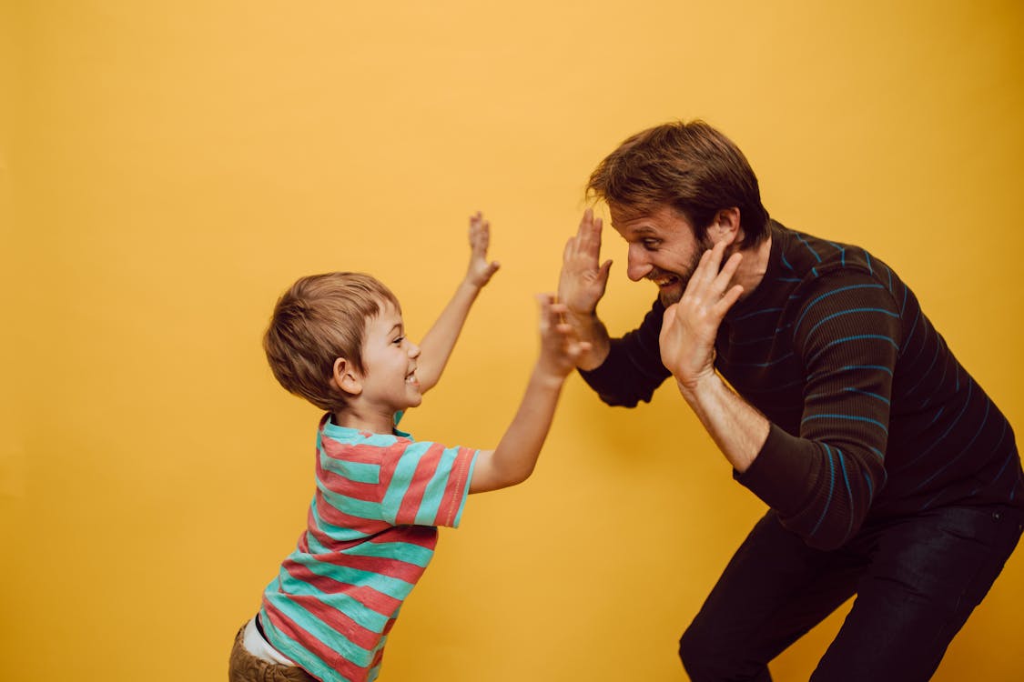 kids giving high fives