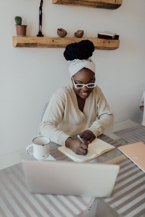 Free A Happy Woman Working from Home Stock Photo