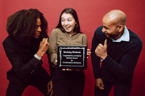 Free A Woman Holding a Recognition Award Stock Photo