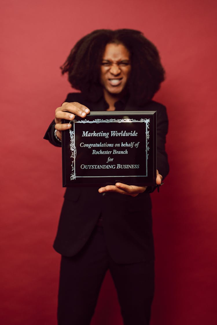 A Man Receiving An Award