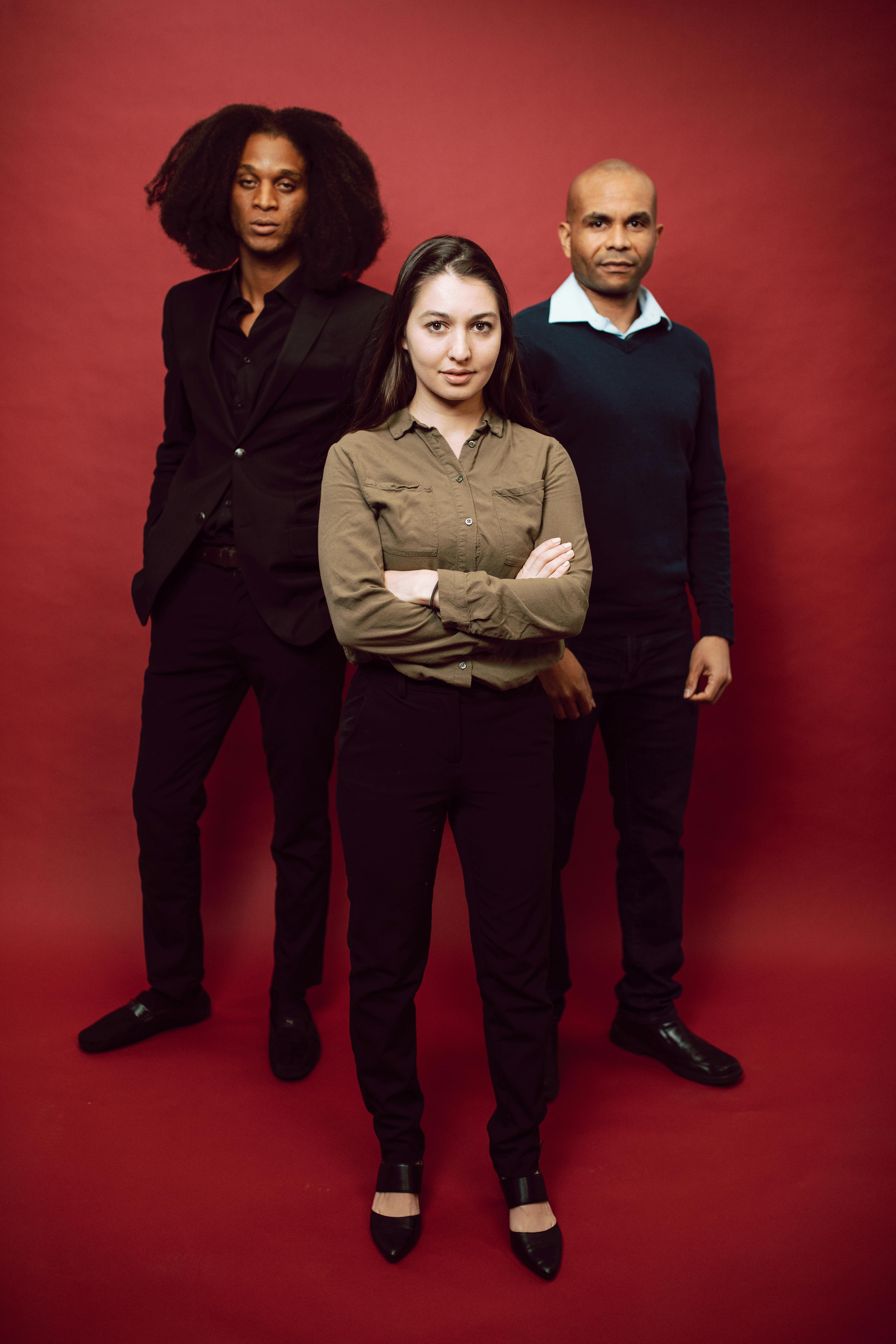 Man in Black Jacket Standing Beside Woman in Gray Sweater