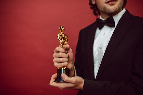 An Actor Holding His Award