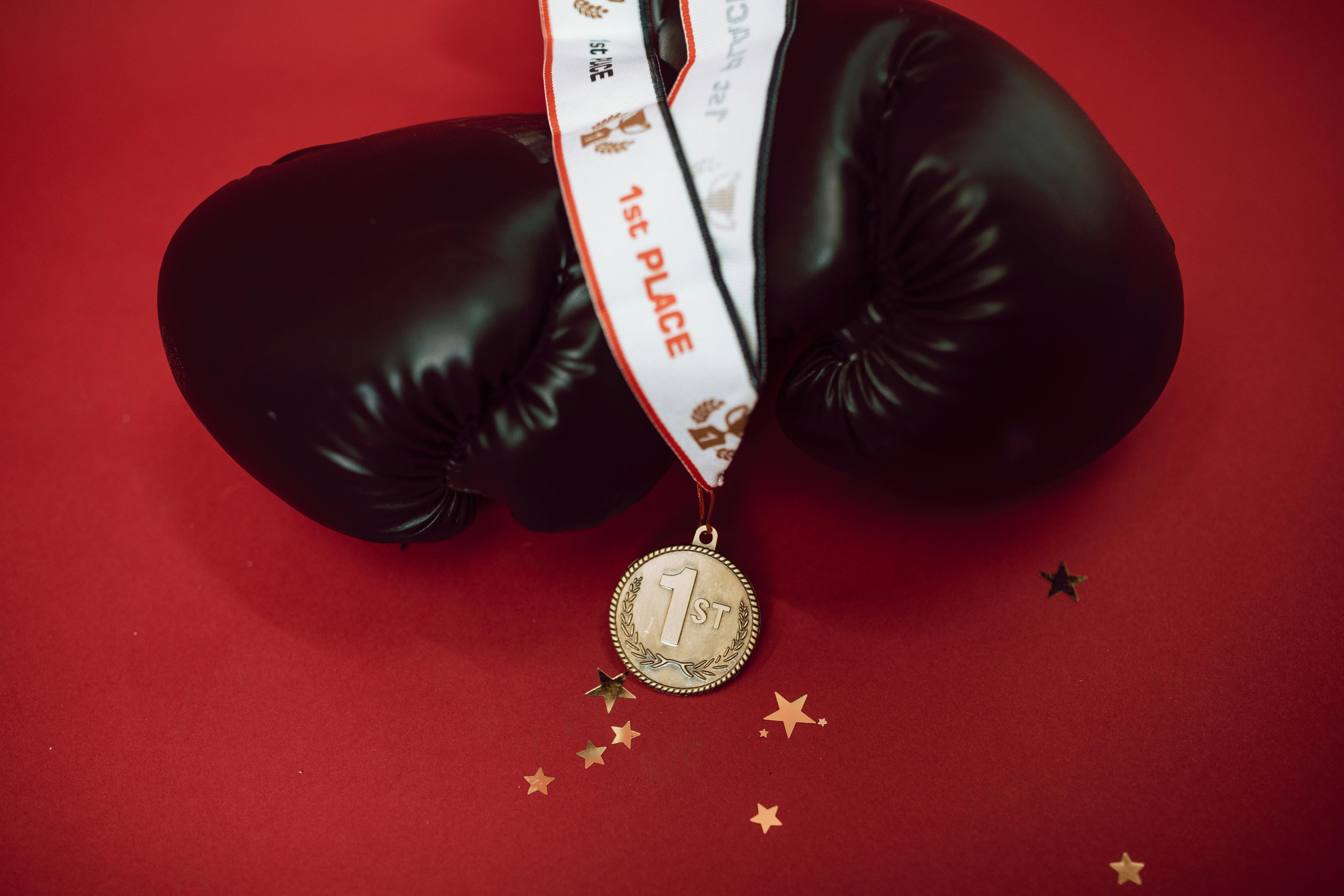 a medal and boxing gloves