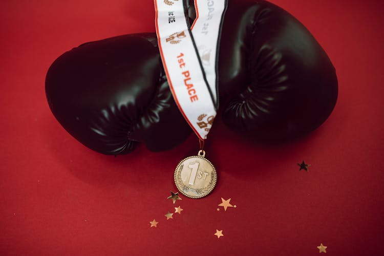 A Medal And Boxing Gloves