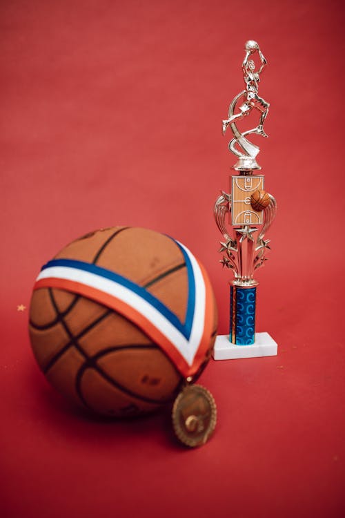 A Medal on a Ball and a Basketball Trophy