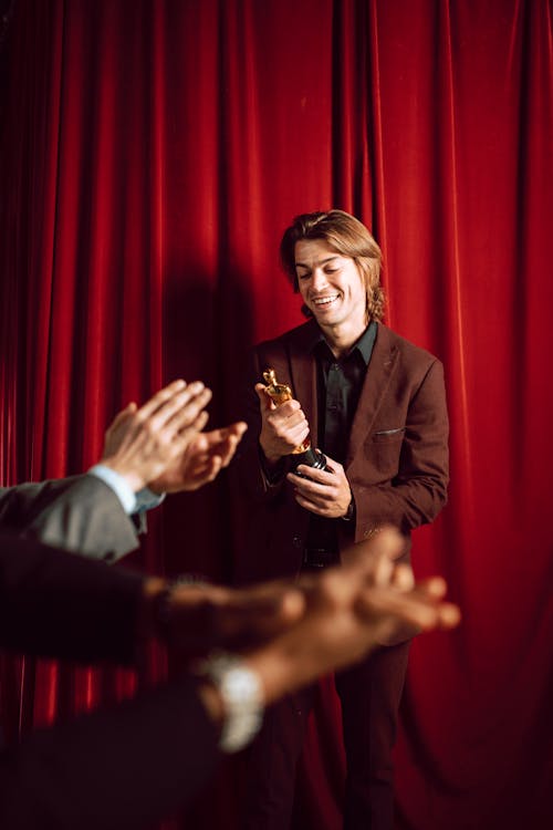 Free People Clapping for an Award Winning Actor Stock Photo