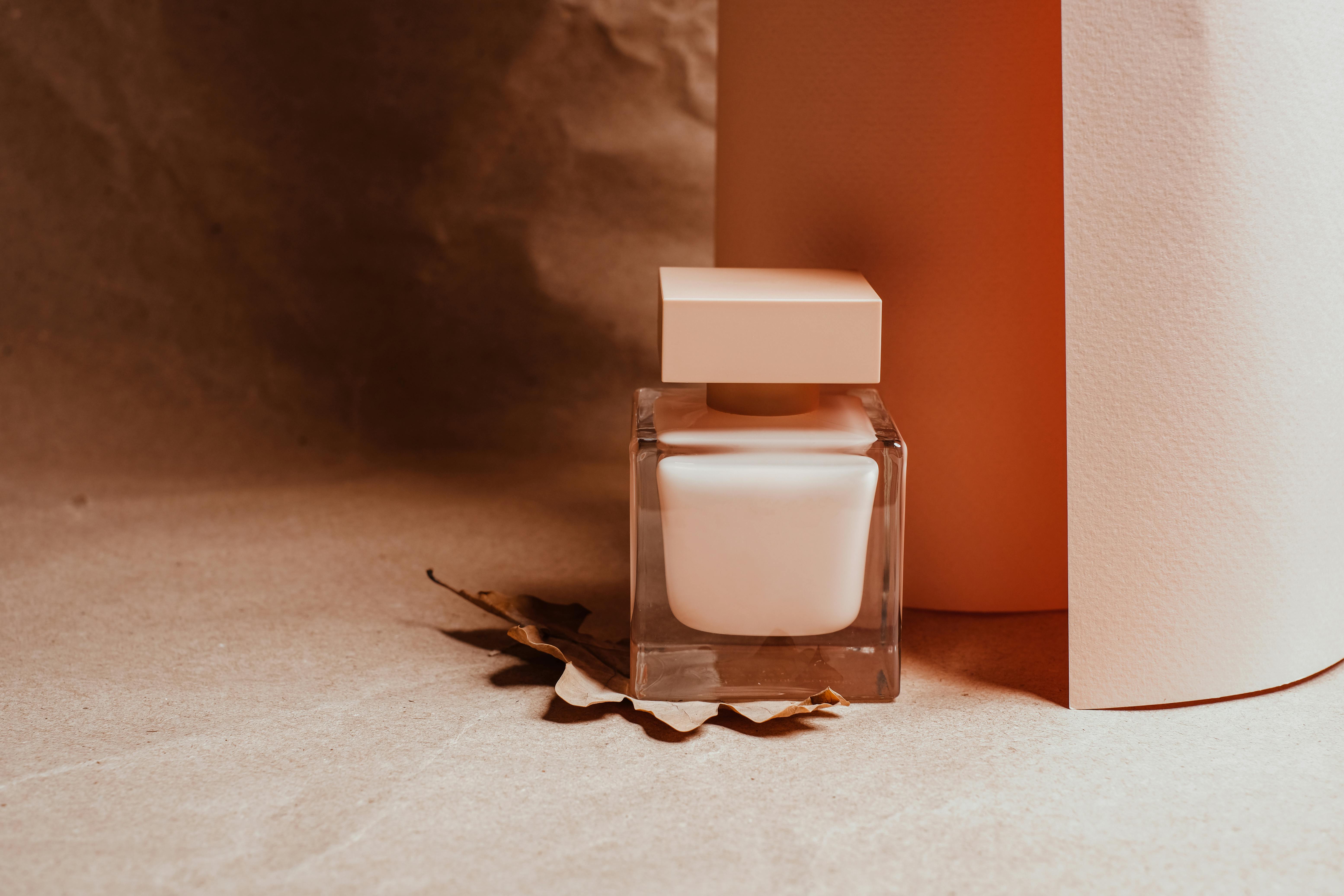 Sophisticated square cosmetic jar in minimalist still life. Perfect for product mockup or branding.