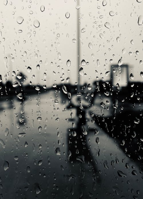 Close-Up Shot of Dewdrops on a Glass Window