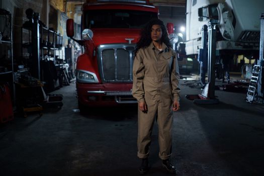 A Woman Standing in Front of a Truck