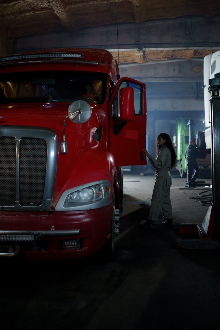 A Woman Looking The Red Truck